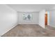 Bright living room featuring tile floors, fresh paint, and a large window at 842 E Village Circle N Dr, Phoenix, AZ 85022