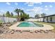 Backyard pool featuring desert landscaping, a privacy wall, and mature trees at 842 E Village Circle N Dr, Phoenix, AZ 85022