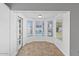 Cozy sunroom featuring tile floors, three large windows overlooking the pool, and fresh paint at 842 E Village Circle N Dr, Phoenix, AZ 85022