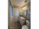 Neutral bathroom featuring a granite-topped vanity, decorative mirror and good natural light at 8632 E Thornwood Dr, Scottsdale, AZ 85251