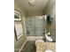 Bathroom featuring a shower-tub combo with sliding doors, toilet and granite counter-topped vanity at 8632 E Thornwood Dr, Scottsdale, AZ 85251
