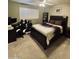 Bedroom with a ceiling fan, window with shutters and modern furniture at 8632 E Thornwood Dr, Scottsdale, AZ 85251