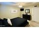Cozy bedroom featuring a dresser, TV, and comfortable carpet at 8632 E Thornwood Dr, Scottsdale, AZ 85251