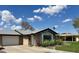 Attractive single-story home with well-kept landscaping and a garage, ideal for comfortable suburban living at 8632 E Thornwood Dr, Scottsdale, AZ 85251