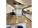 Spacious kitchen featuring granite countertops, stainless appliances, and bright white cabinets at 8632 E Thornwood Dr, Scottsdale, AZ 85251