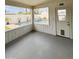 Enclosed patio offers views of the backyard swimming pool and desert landscaping at 8632 E Thornwood Dr, Scottsdale, AZ 85251
