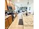 Well-lit kitchen featuring granite countertops, stainless steel appliances, and an open view to the living area at 9825 W Trumbull Rd, Tolleson, AZ 85353
