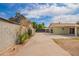 View of the backyard, showcasing a long driveway that extends to the rear of the property at 1010 W 5Th Pl, Mesa, AZ 85201