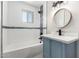 Updated bathroom featuring modern vanity, tile details, and updated fixtures offers a clean, luxurious feel at 1010 W 5Th Pl, Mesa, AZ 85201