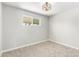 Bedroom with carpeted floors, a modern light fixture, and one window that provides lots of natural light at 1010 W 5Th Pl, Mesa, AZ 85201
