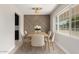 Charming dining area with a decorative wall, dining table, and bright natural light at 1010 W 5Th Pl, Mesa, AZ 85201