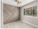 Stylish dining space with a modern decorative wall and large windows at 1010 W 5Th Pl, Mesa, AZ 85201