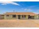 Charming single-story home with a brown roof, desert landscaping, and an attached carport at 1010 W 5Th Pl, Mesa, AZ 85201