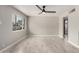 Bright and spacious living area with tile flooring and a large window for natural light at 1010 W 5Th Pl, Mesa, AZ 85201