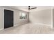Inviting living room with tile flooring, large window, and dark entry door at 1010 W 5Th Pl, Mesa, AZ 85201