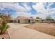 The back of the house includes a covered patio, an outdoor dining set and a well-kept yard at 1010 W 5Th Pl, Mesa, AZ 85201