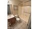 This bathroom has tile flooring, a vanity, a toilet, and a shower at 1018 W Helena Dr, Phoenix, AZ 85023