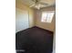 This bedroom features hardwood floors, a ceiling fan, and a large closet at 1018 W Helena Dr, Phoenix, AZ 85023