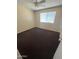 This bedroom is bright with hardwood floors, a ceiling fan, and neutral paint at 1018 W Helena Dr, Phoenix, AZ 85023