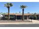 Charming single-story home with palm trees, desert landscaping, and a welcoming front entrance at 1018 W Helena Dr, Phoenix, AZ 85023