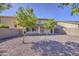 View of the backyard with desert landscaping and a covered patio at 11629 W Washington St, Avondale, AZ 85323