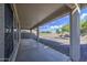 Covered patio overlooks the low maintenance backyard with gravel at 11629 W Washington St, Avondale, AZ 85323
