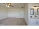 Bedroom with ensuite bathroom featuring a double vanity and framed mirrors at 11629 W Washington St, Avondale, AZ 85323