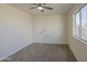 Bedroom with a ceiling fan and a window at 11629 W Washington St, Avondale, AZ 85323