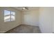 Bedroom with a ceiling fan, closet, and window at 11629 W Washington St, Avondale, AZ 85323
