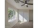 Bedroom featuring a bright window, carpet, and a sliding closet door at 11629 W Washington St, Avondale, AZ 85323