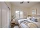 Comfortable bedroom with a full bed, closet, and a large window at 11629 W Washington St, Avondale, AZ 85323