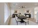 Elegant dining room with a dark wood table, seating for six, and stylish light fixture at 11629 W Washington St, Avondale, AZ 85323