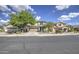 Inviting two-story home featuring a well-maintained lawn, desert landscaping, and a convenient two-car garage at 11629 W Washington St, Avondale, AZ 85323