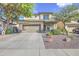 Attractive home featuring a two-car garage, desert landscaping, and a tidy, welcoming facade at 11629 W Washington St, Avondale, AZ 85323