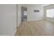 Open-concept living space with hardwood floors and modern lighting, creating a welcoming ambiance at 11629 W Washington St, Avondale, AZ 85323