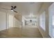 Open-concept living space with hardwood floors connecting the living room to the modern kitchen at 11629 W Washington St, Avondale, AZ 85323