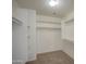 Bright walk-in closet featuring shelving and rods for maximum storage space at 11629 W Washington St, Avondale, AZ 85323