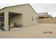 View of covered patio, home exterior, and gravel backyard, with a block wall for privacy at 1246 E Thomas Dr, Casa Grande, AZ 85122