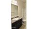 Bathroom with a granite vanity, a large mirror, and a shower and tub at 1246 E Thomas Dr, Casa Grande, AZ 85122