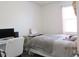 Bedroom featuring a bed, a desk, a chair, and a window at 1246 E Thomas Dr, Casa Grande, AZ 85122