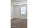 Cozy bedroom featuring neutral carpet, a ceiling fan, and a bright window at 1246 E Thomas Dr, Casa Grande, AZ 85122