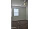 Spacious bedroom with neutral carpet, and a bright window allowing natural light at 1246 E Thomas Dr, Casa Grande, AZ 85122