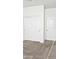 Bedroom with neutral carpet and sliding closet doors that offer extra storage space at 1246 E Thomas Dr, Casa Grande, AZ 85122