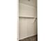 Walk-in closet featuring a built-in shelf and rod, providing organized storage for clothes and accessories at 1246 E Thomas Dr, Casa Grande, AZ 85122