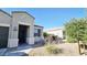 Inviting single-story home featuring desert landscaping, a covered entry and a window at 1246 E Thomas Dr, Casa Grande, AZ 85122