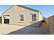 Rear exterior showcasing stucco walls, windows and desert landscaping in the backyard at 1246 E Thomas Dr, Casa Grande, AZ 85122
