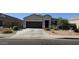 Attractive single-story home with a well-maintained front yard and a two-car garage at 1246 E Thomas Dr, Casa Grande, AZ 85122