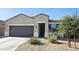 Inviting single-story home with a well-manicured desert landscape and charming front entry at 1246 E Thomas Dr, Casa Grande, AZ 85122
