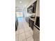 Open kitchen with stainless steel appliances, granite countertops, and tile flooring at 1246 E Thomas Dr, Casa Grande, AZ 85122