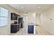 Well-lit kitchen with stainless steel appliances and dark cabinets at 1246 E Thomas Dr, Casa Grande, AZ 85122